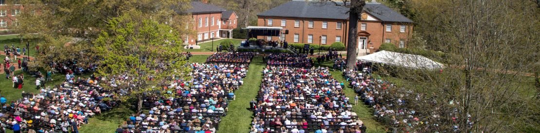Graduates and families at graduation ceremony